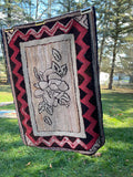 Floral Hooked rug with striking zig-zag border