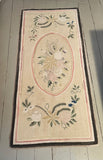 Floral hooked rug in pastel shade of colour