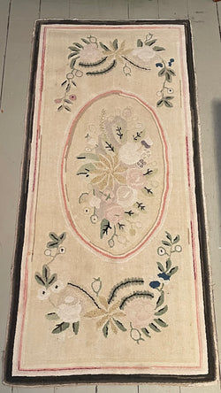 Floral hooked rug in pastel shade of colour